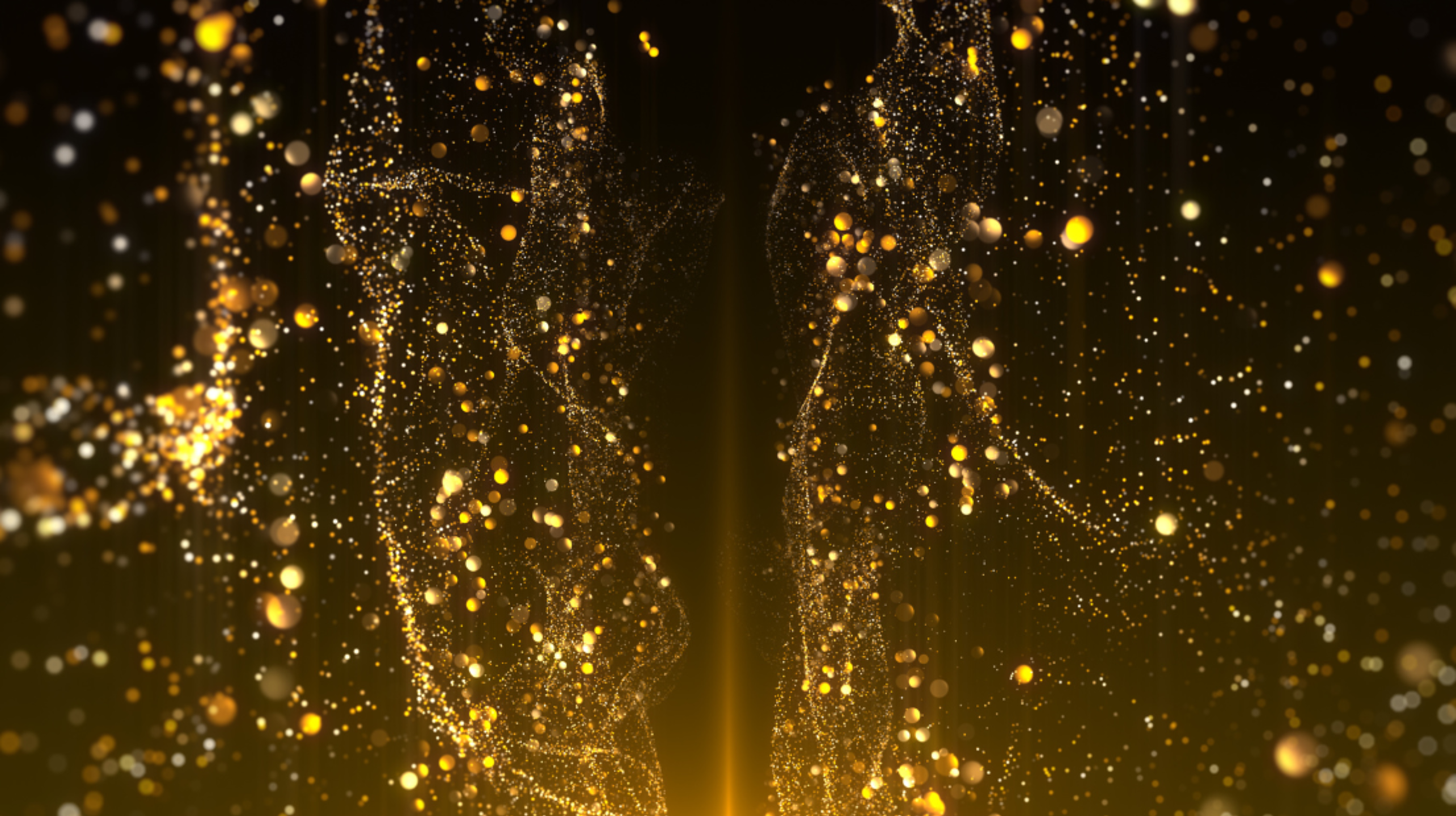 Abstract golden particles forming fluid shapes on a dark background, evoking elegance and celebration.