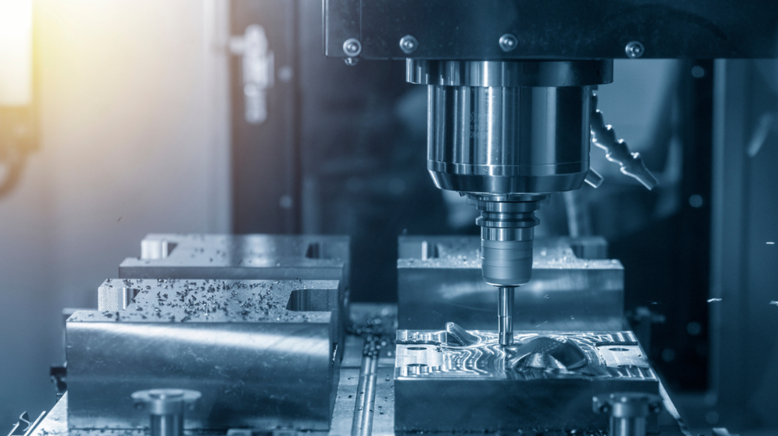 Close-up of a CNC machine milling a metal component